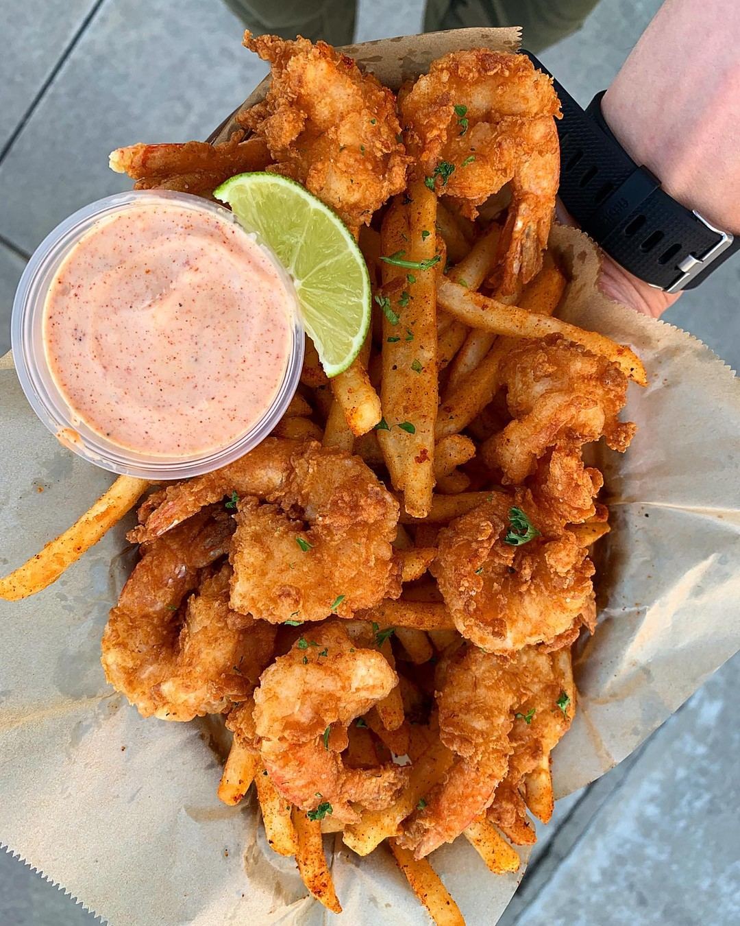 Fried Cajun shrimp and fries with dipping sauce