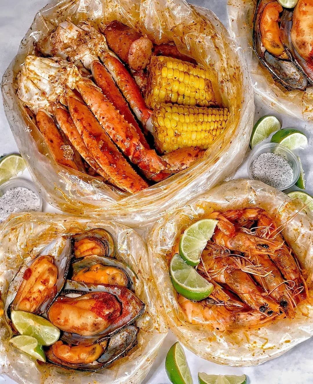 Seafood boil bags with crab legs, mussels and corn